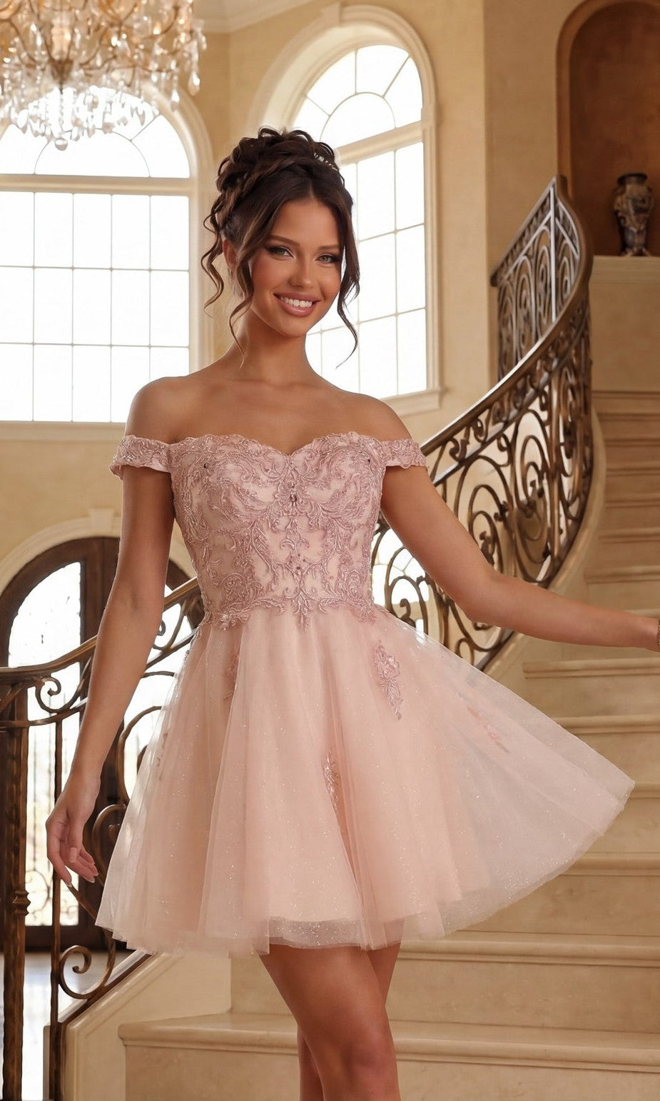 A woman in the blush Beaded-Corset Short Babydoll Hoco Dress C314 poses on a staircase in an elegant, sunlit room with large windows and ornate railings.